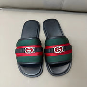 Gucci Men’s Interlocking G Slide Sandals in black with logo